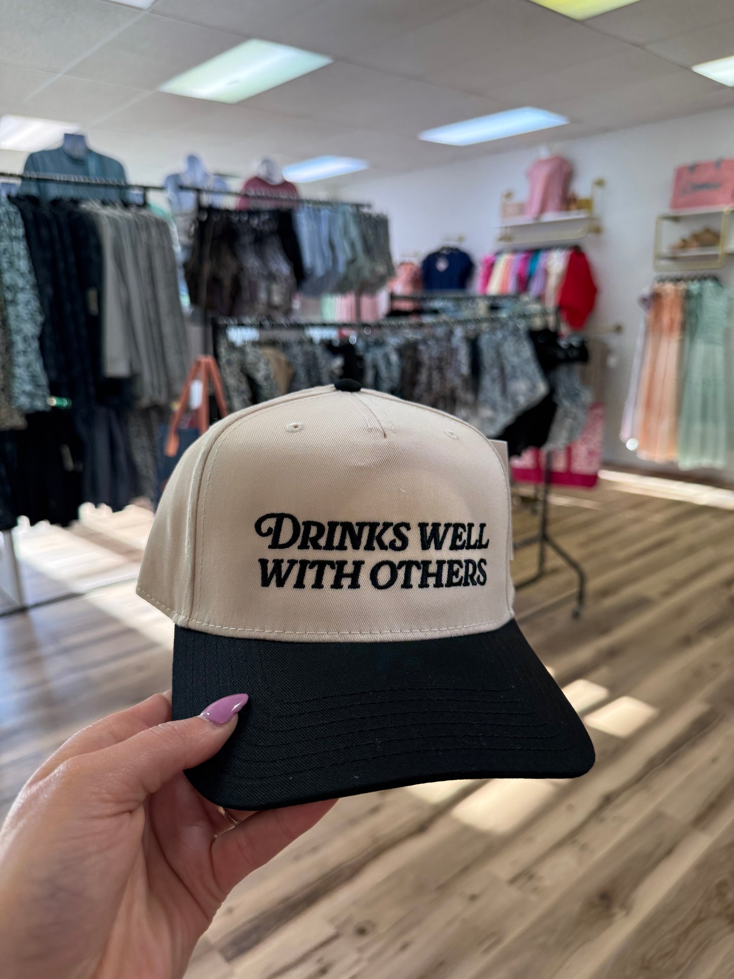 DRINKS WELL WITH OTHERS BLK/TAN TRUCKER HAT